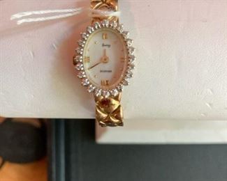 Vintage ladies Geneva 14k watch with 24 round brilliant cut diamonds