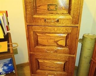 Vintage 4 drawer Oak file cabinet with key.