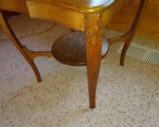Antique oak side table with cantilever legs and fancy details