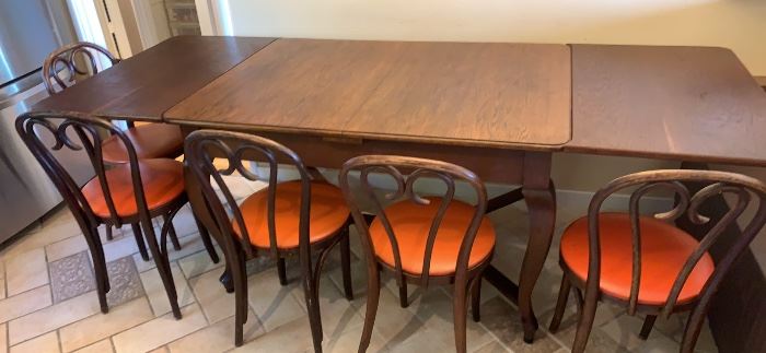 Dining table with two collapsible leaves seats 10 when expanded 

Set of 6 antique chairs