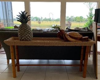 Bamboo and rattan sofa table with huge ceramic pineapple and sea turtle scuplture