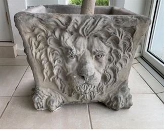 One of a pair of large concrete lion planters