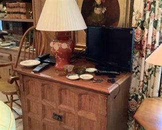 TV storage cabinet lamps TV and oil painting