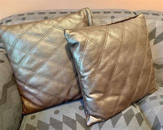 $80 - Pair of quilted, brown leather throw pillows; 19" x 19" square