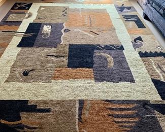 $2595 - Genuine hand woven oriental rug; 11' 7"L x 8' 9"W