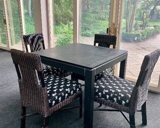$995 - (Table not for sale) 4 McGuire rattan upholstered chairs - Condition consistent with use and age; 36"H x 20"W x 23"D. Height to seat approximately 19.5"H
