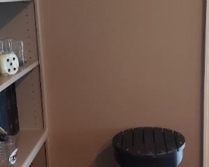 Framed cross stitched ducks, small black table