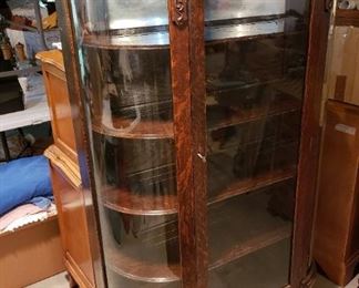 ANTIQUE CURVED GLASS CABINET