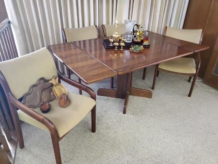 Stunning, rare vintage Koa wood table with 2 leaves and 4 chairs. Hawaiian Koa wood has not been allowed to be harvested and exported since the 1970s.