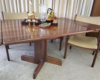 Stunning, rare vintage Koa wood table with 2 leaves and 4 chairs. Hawaiian Koa wood has not been allowed to be harvested and exported since the 1970s.