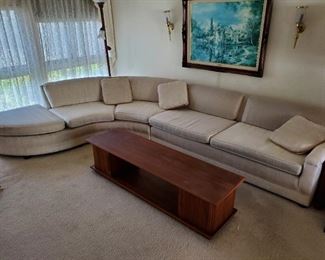 Mid century curved sectional sofa (available for presale), Barzilay MCM console table with tambour doors.
