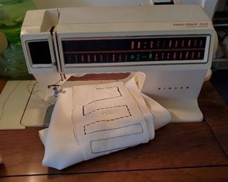Singer Touch-Tronic 2001 sewing machine. Many styles of stitches programmed in. Tested and in excellent working condition.