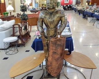 Knight in shining armor! We have three of these unique tables.
