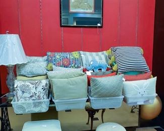 Lots of decorative pillows!  Vintage Singer Sewing Stool!  Adorable vanity stool to the right.