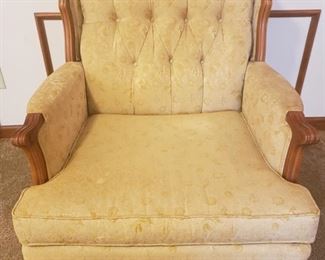 This light gold with wooden accent "Riverly House" chair is a gem. "Riverly House" was a brand name of Rhodes Furniture which signified quality at it's best from the 1960's. Please see the matching couch in this sale as well. This chair is approximately 41'' H x 32'' W x 29'' D https://ctbids.com/#!/description/share/932848