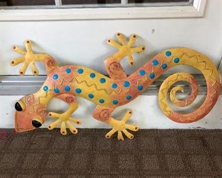 Metal sculpture of a lizard (gecko?).