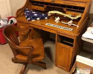 Rolltop desk; oak office chair.