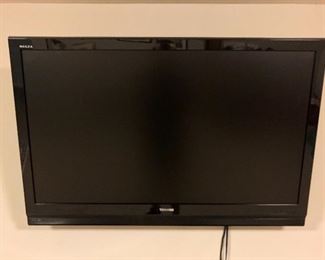 Wall-mounted Toshiba Regza TV.