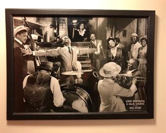 Framed Louis Armstrong and Billie Holiday poster.