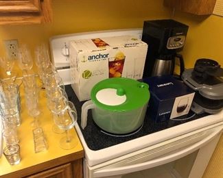 Kitchen contains quality cookware, small appliances and glassware.