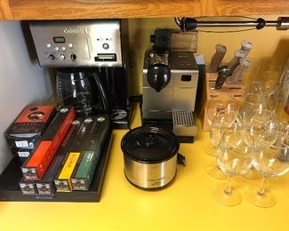 Cuisinart coffee maker and DeLonghi espresso maker.