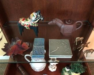 Art tiles, pottery and metalware.