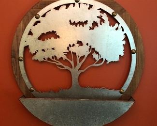 Round Tree of Life wood and metal wall decor.