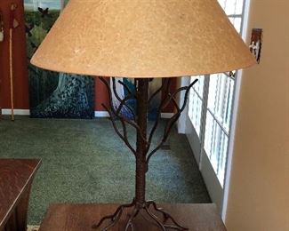 Tree-shaped lamp with metal base.