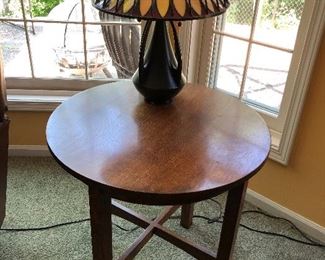 Stickley living room round lamp table; Quoizel mission-/craftsman-style table lamp.