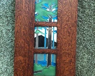 Art tiles in a Stickley or Stickley-style mission frame.