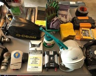 Numerous tools and yard and garden accessories in the garage.