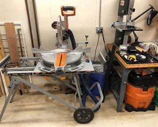 Ridgid 15-amp 12-in. Sliding Compound Miter Saw with Adjustable Laser. Set includes a Dust Right Dust Separator and a Ridgid 16-gallon professional set/dry vac.