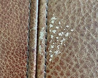 detail- small mark on the leather of the ottoman