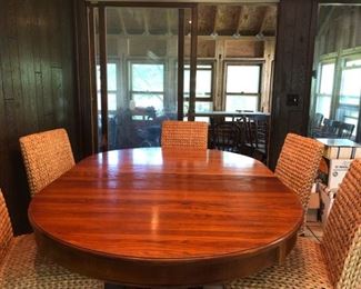 Dining room table with 5 woven wicker chairs