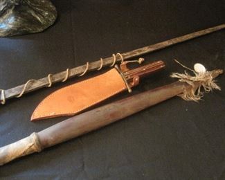 Authentic Native Indian Bows, one from the Pawnee Tribe. The feathers cannot be sold.