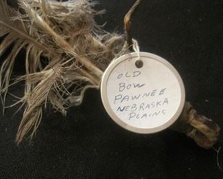Authentic Native Indian Bows, one from the Pawnee Tribe. The feathers cannot be sold.