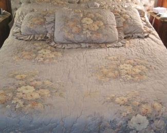 Queen size Bed with quilted headboard and bedding