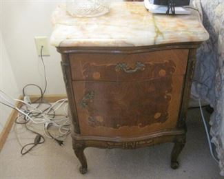 A pair of Marble Topped Night Stands.