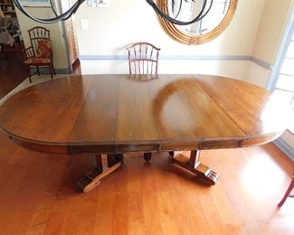Spanning 4 generations, this early 20th Century, solid oak dining table still shines! 