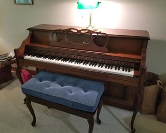 Grand brand upright piano in solid cherry