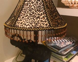 elephant under leopard skin umbrella