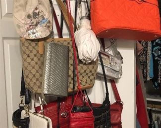 Bags and purses, some from designers, such as Malandrino