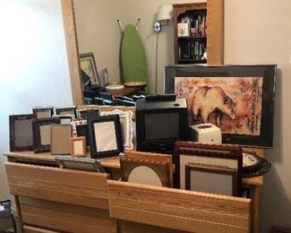 Assorted photos frames, double dresser with mirror