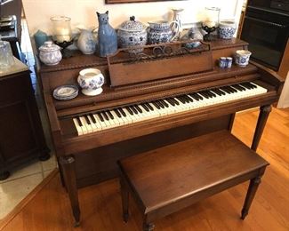 Lovely wooden upright piano with bench. Assorted ceramic, china, and glassware pieces, some marked. 
