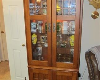 Beautiful Mission style Lighted display case.