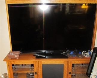 Custom handcrafted & built by a master carpenter w/ stained glass. 2pc. entertainment center.  One-of-a-kind-piece.  TV-SONY BRAVIA 3D television. w/ 4 glasses. 