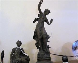 A metal roman soldier from an antique clock.  Antique bronze lamp French sculpture by artist Louis Moreaux