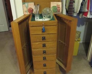 A beautiful jewelry stand that was custom designed and built by our master carpenter. One-of-a-kind.