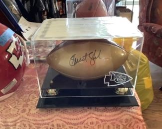 Gold football autographed by Priest Holmes with certificate.