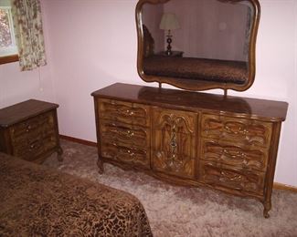 brown bedroom dresser and nightstand